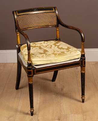 Lot 513 - A Regency ebonised and gilt open armchair