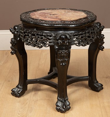 Lot 330 - A Chinese hardwood jardinière stand with a marble top