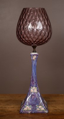 Lot 380 - A late 19th century Royal Doulton stoneware lamp base with an amethyst glass shade