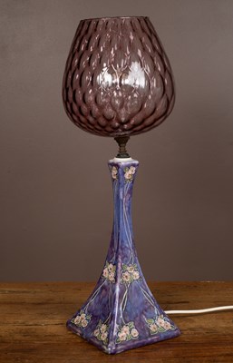 Lot 272 - A late 19th century Royal Doulton stoneware lamp base with an amethyst glass shade