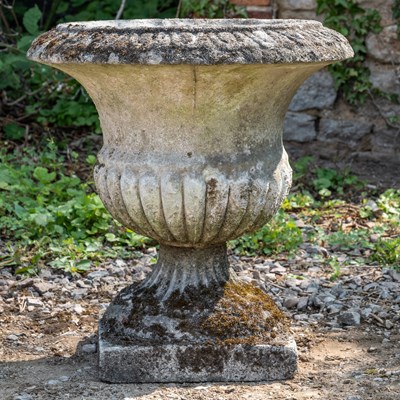 Lot 1181 - A cast reconstituted stone garden urn