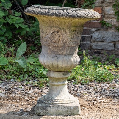 Lot 1210 - A cast reconstituted stone garden urn