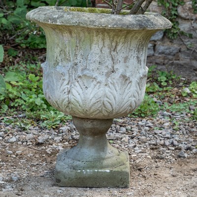 Lot 1368 - A cast reconstituted stone garden urn