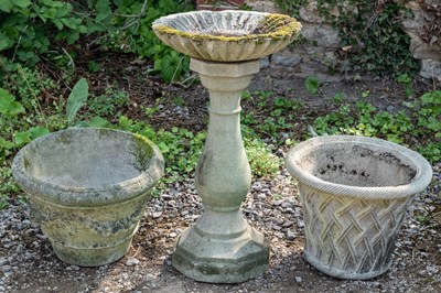 Lot 1193 - A cast reconstituted stone bird bath; together with two garden pots