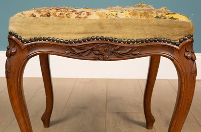 Lot 96 - A French carved walnut bergère armchair; together with a French carved walnut dressing table stool