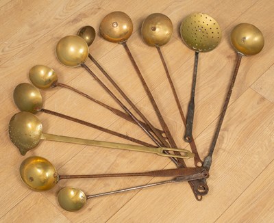 Lot 356 - A collection of antique wrought iron and brass ladles and strainers