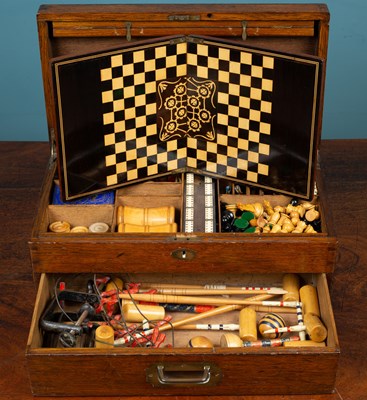 Lot 361 - A 1930's oak cased games compendium