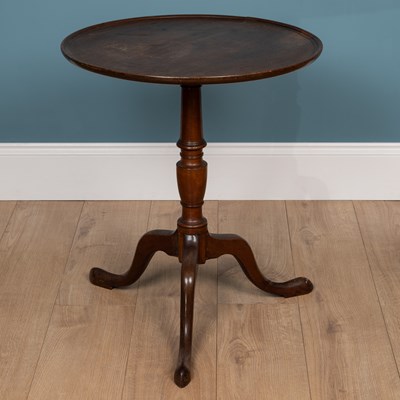 Lot 486 - A Georgian style mahogany circular tilt top tripod table