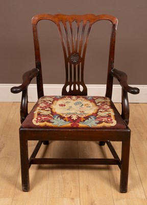 Lot 214 - An antique mahogany elbow chair