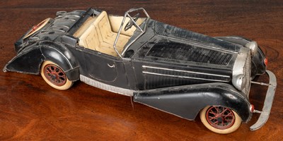 Lot 286 - A tinplate model of a vintage open topped car