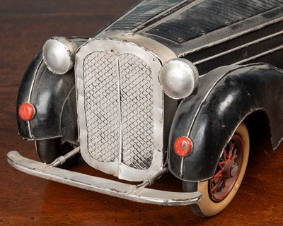 Lot 286 - A tinplate model of a vintage open topped car