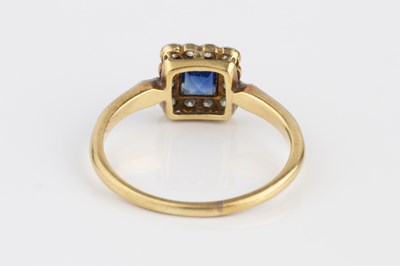 Lot 94 - A sapphire and diamond cluster ring, the...