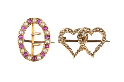 Lot 11 - Two half pearl brooches, the first designed as...