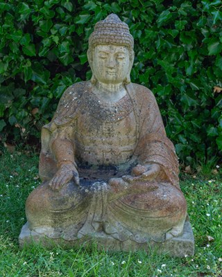 Lot 1222 - A cast reconstituted stone depicting a seated Buddha