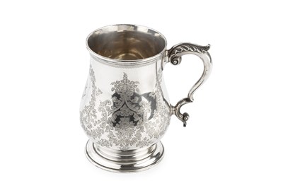 Lot 615 - A late Victorian silver mug, of baluster form,...