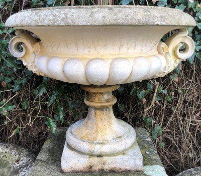 Lot 1260 - A cast reconstituted stone shallow campana urn