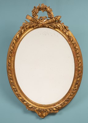 Lot 562 - A gilt-framed oval wall mirror