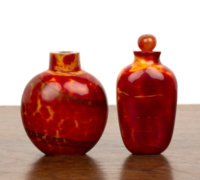 Lot 239 - Two Peking glass snuff bottles Chinese,...