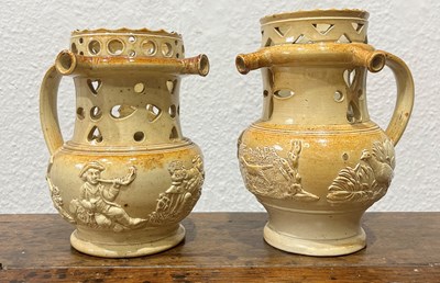 Lot 255 - Two salt-glazed puzzle jugs by Brampton...