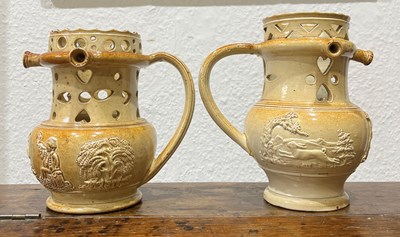 Lot 255 - Two salt-glazed puzzle jugs by Brampton...