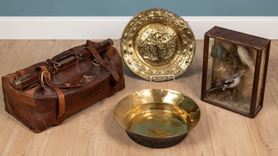 Lot 665 - A brass alms dish, a brass basin; a leather Gladstone bag, and a taxidermic group