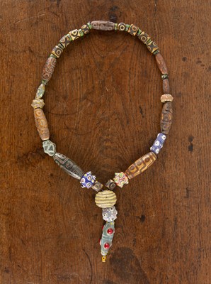 Lot 283 - Dzi bead necklace with two Roman spherical...