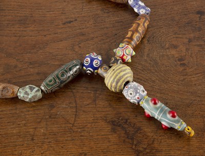 Lot 283 - Dzi bead necklace with two Roman spherical...