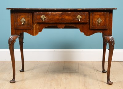 Lot 688 - An 18th century style walnut lowboy or side...