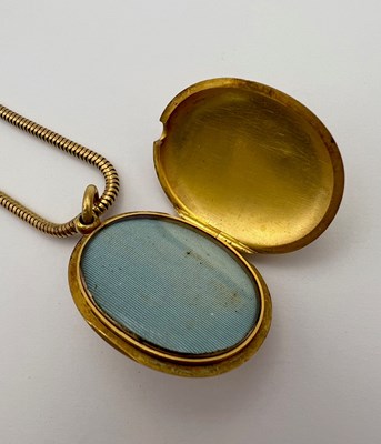 Lot 42 - A Victorian enamel locket pendant, the oval...