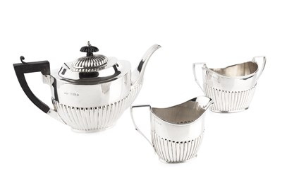 Lot 626 - A George V silver teapot, of oval half lobed...