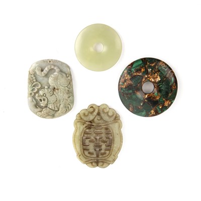 Lot 325 - Four Chinese carved pendants or bi discs 20th...