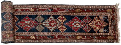 Lot 1070 - An Oriental blue ground runner