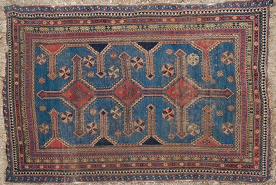 Lot 1073 - An Oriental blue ground rug