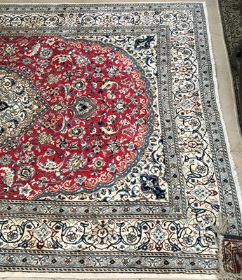 Lot 1078 - A red ground Oriental rug