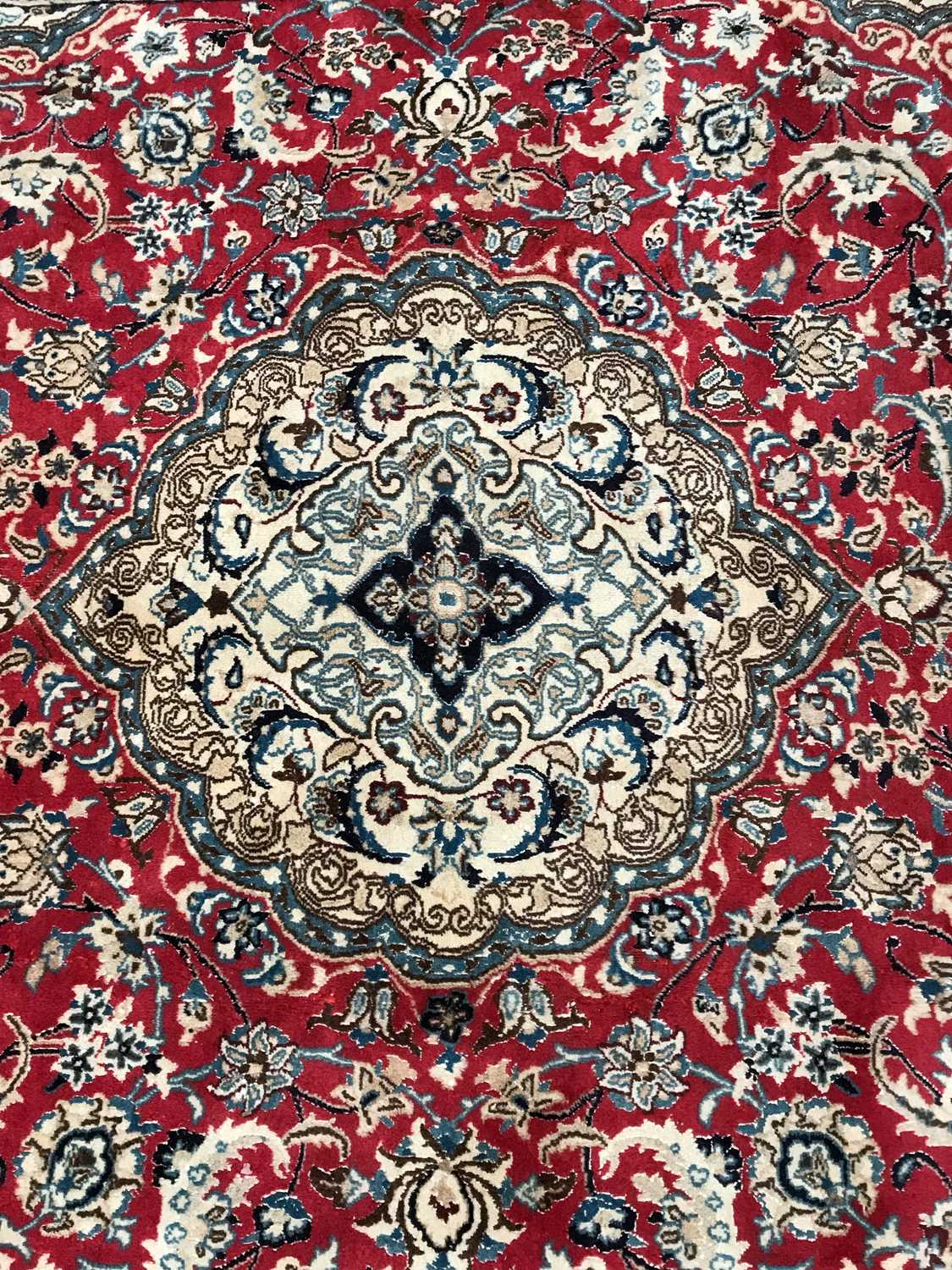 Lot 1078 - A red ground Oriental rug