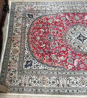 Lot 1078 - A red ground Oriental rug