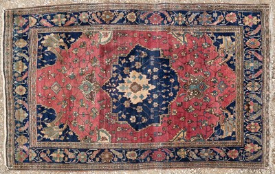 Lot 1076 - An Oriental pink ground rug