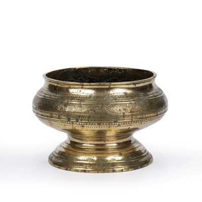 Lot 28 - An antique Eastern brass bowl with engraved...