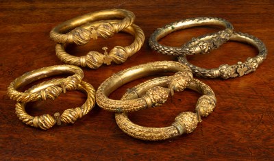 Lot 7 - A collection of four pairs of Indonesian style anklets