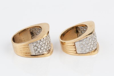 Lot 195 - Two diamond dress rings, of similar design,...