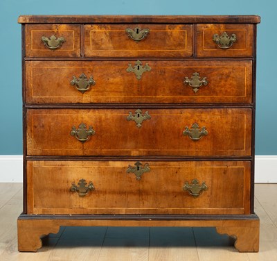 Lot 686 - A George III walnut chest of94 drawers