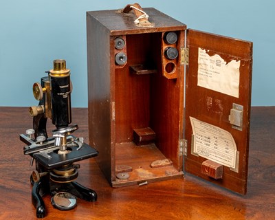 Lot 28 - A W Watson & Sons monocular microscope and an adjustable slide clamp by J Swift & Son London