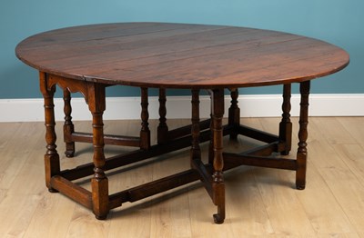 Lot 660 - A 19th century oak gate leg table