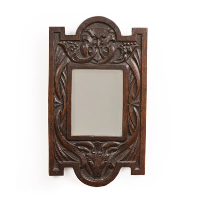 Lot 64 - In the Gothic style Oak, fable carved mirror...