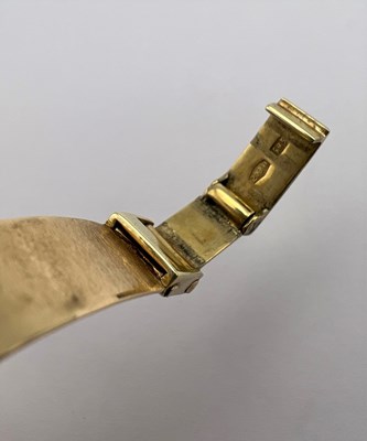 Lot 246 - A yellow precious metal bracelet watch, the...