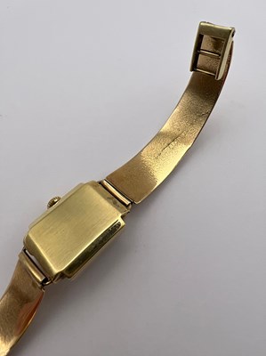 Lot 246 - A yellow precious metal bracelet watch, the...