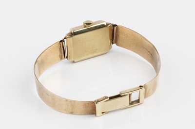 Lot 246 - A yellow precious metal bracelet watch, the...