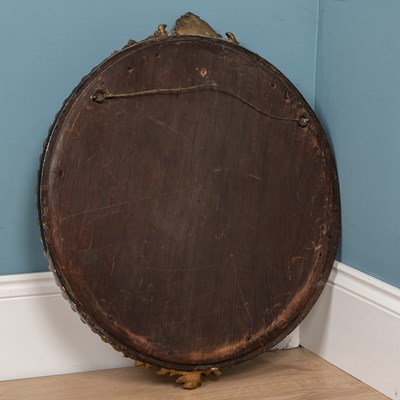 Lot 681 - A circular wall mirror