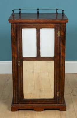 Lot 228 - A Victorian rosewood music cabinet