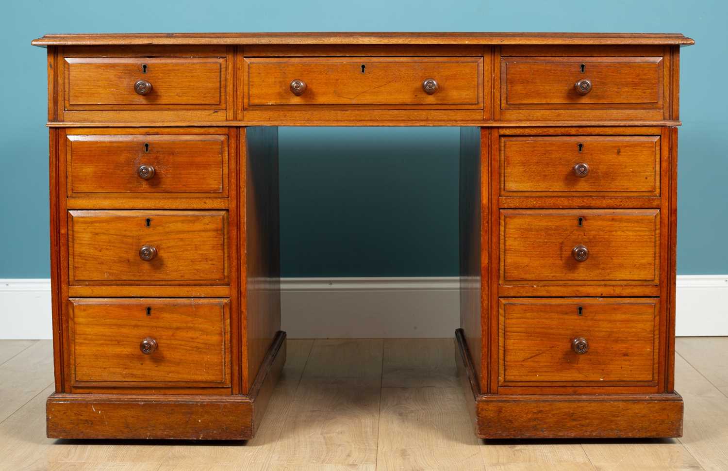 Lot 229 - A mahogany partners desk with leather inset top